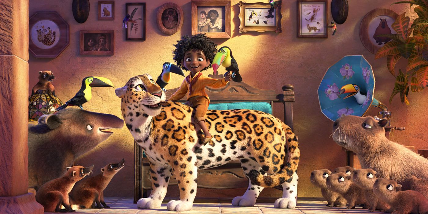 Antonio holds a bird as he rides a jaguar and is surrounded by other animals in Disney's Encanto.