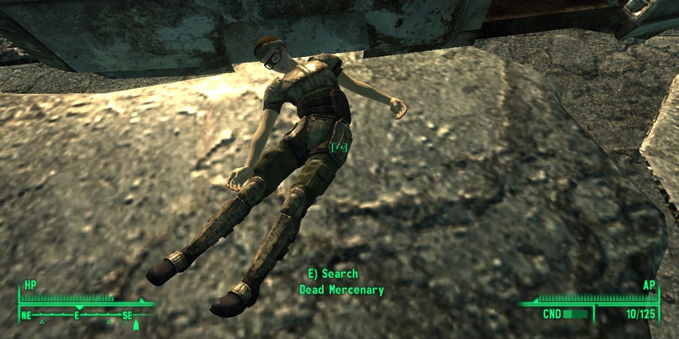 A dead raider on the ground in Fallout 3