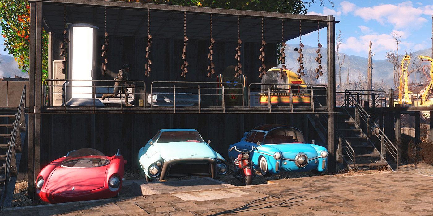 Three restored cars underneath a house in Fallout 4