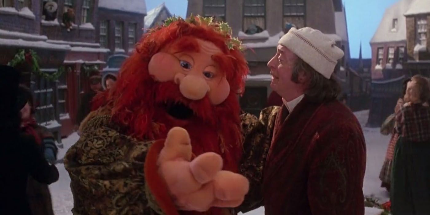 Ghost of Christmas Present and Scrooge (Michael Caine) in The Muppet Christmas Carol