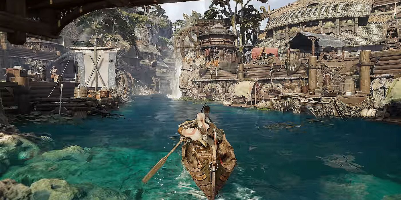 A photo of Kratos and Atreus using a boat to navigate a river surrounded by wooden buildings in God of War: Ragnarok.