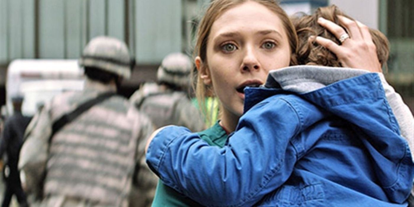 Elle Brody carrying her son and looking scared in Godzilla (2014)