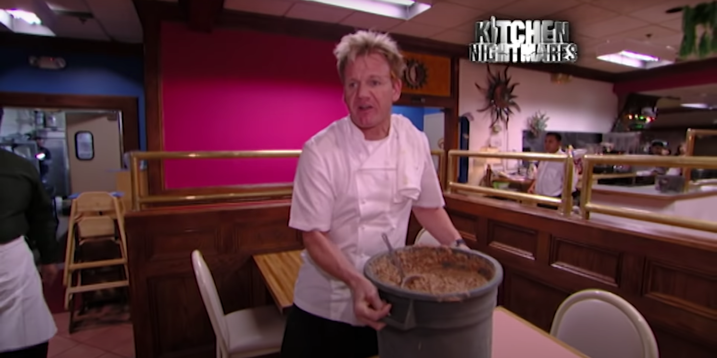 Gordon sets a bucket of expired refried beans onto a table in the dining room of Fiesta Sunrise.