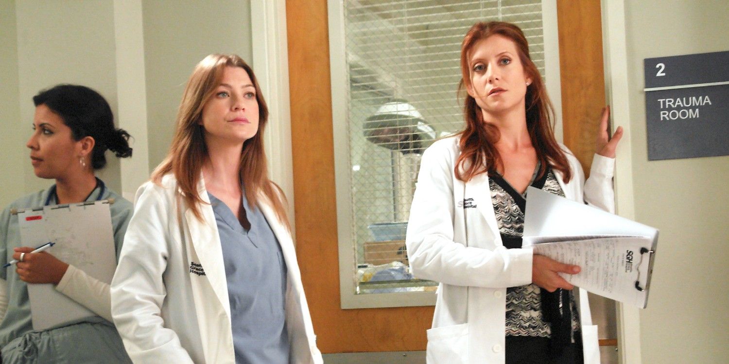 Meredith and Addison standing next to each other at the hospital in Grey's Anatomy