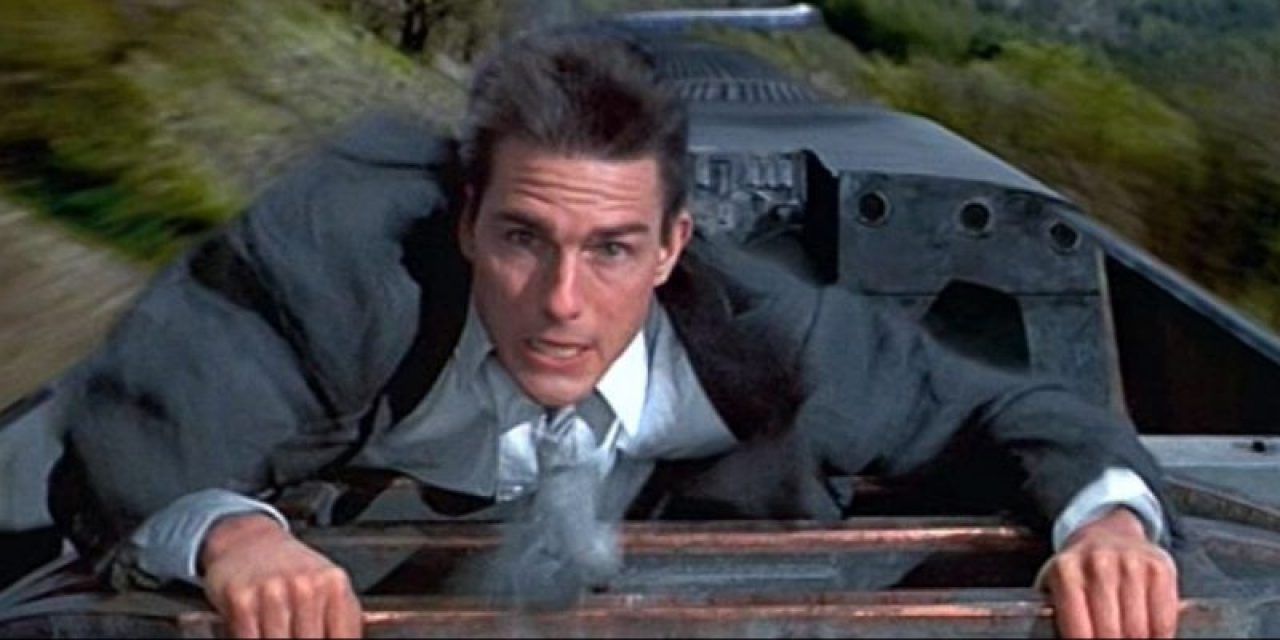 Ethan Hunt on top of a train in Mission: Impossible