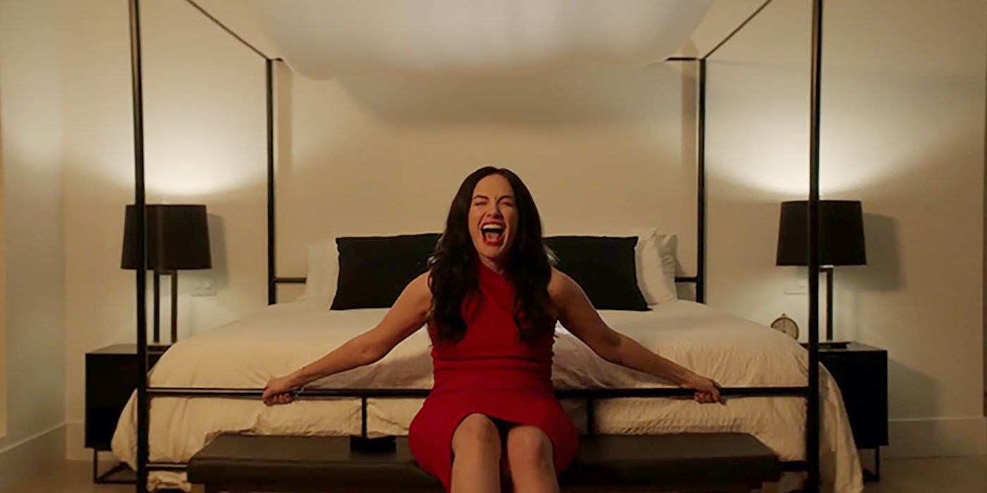 Jenn screams while she's tied to the foot of the bed in Hypnotic.