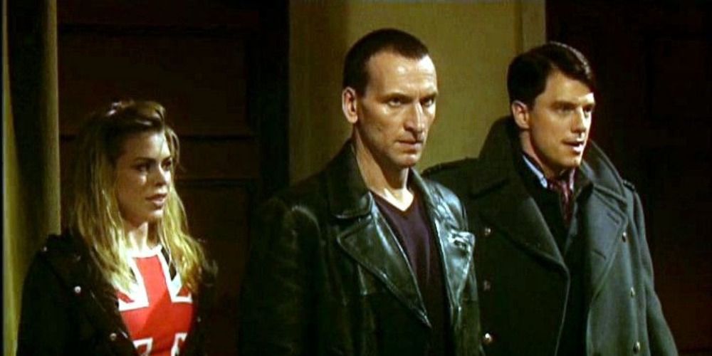 Jack, the Ninth Doctor and Rose stand side by side in Doctor Who