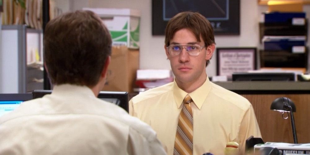 Jim dressed as Dwight from The Office, sat down facing Dwight at their desks