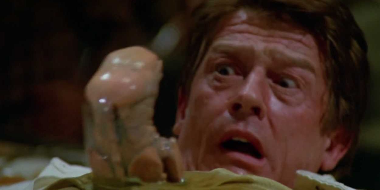 John Hurt looks at an alien bursting from his chest in Spaceballs.