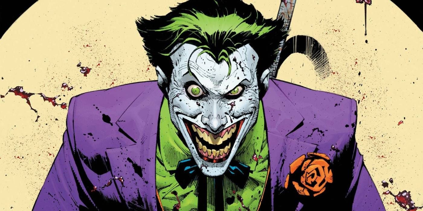 O Coringa ri enquanto coberto de sangue na DC Comics.