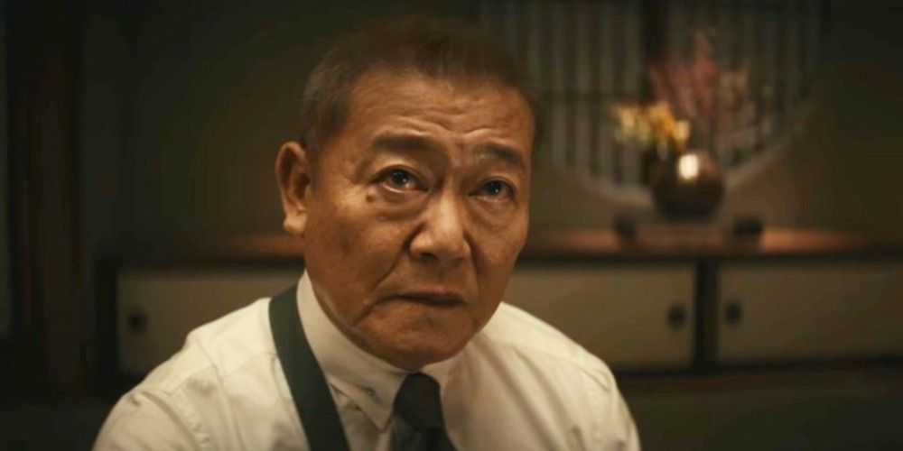 A photo of Kijima looking up in the movie Kate.