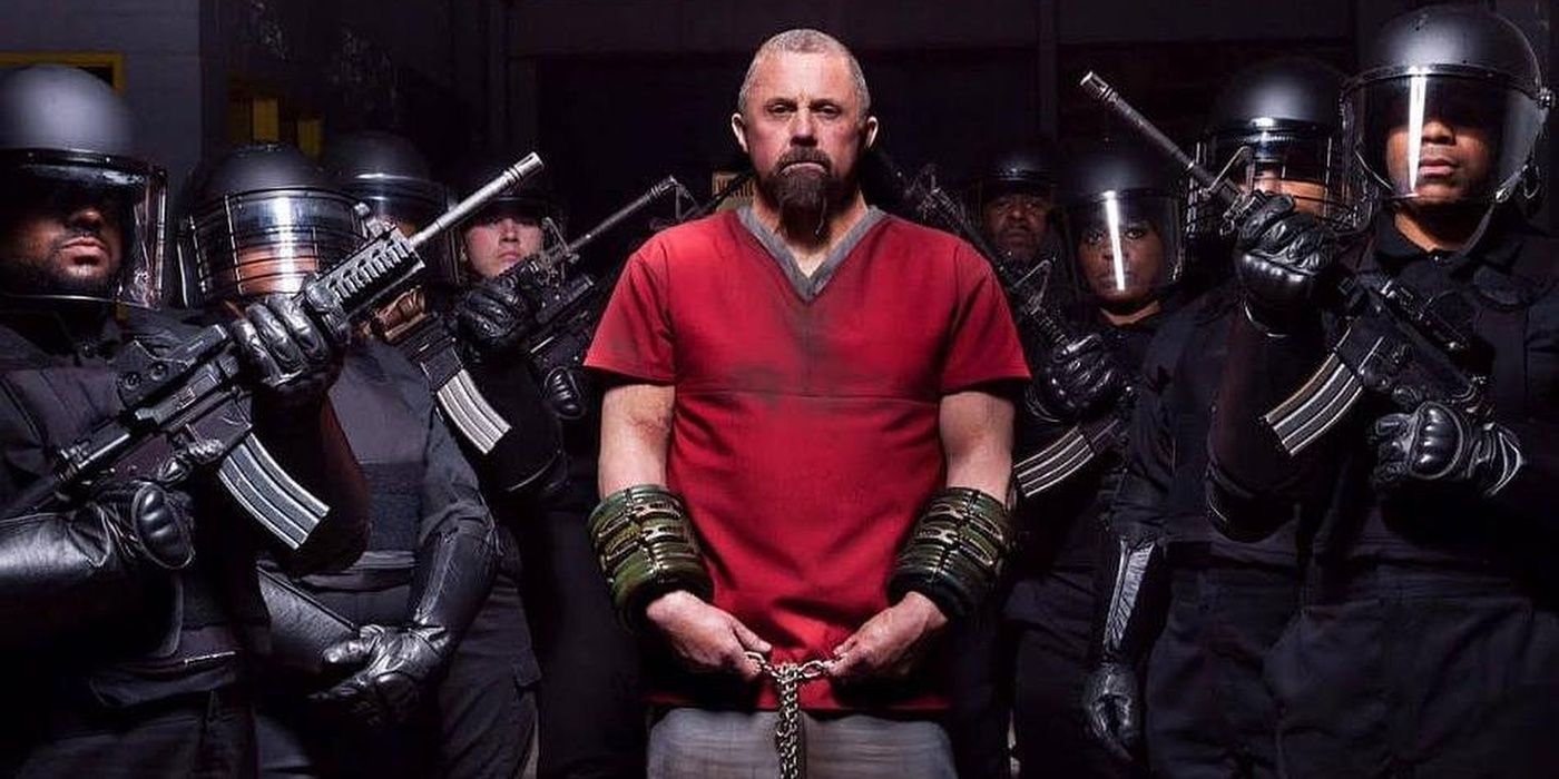 Kane Hodder as Sieg surrounded by Guards in Death House