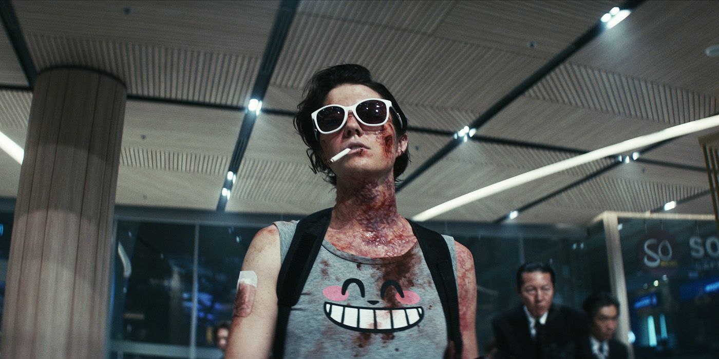 A photo of Mary Elizabeth Winstead smoking a cigarette and wearing sunglasses in the movie Kate.