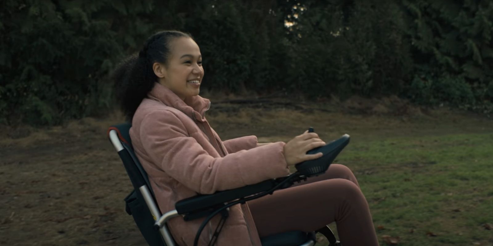 Leeza Scarborough smiles while riding in her motorized wheelchair in Midnight Mass