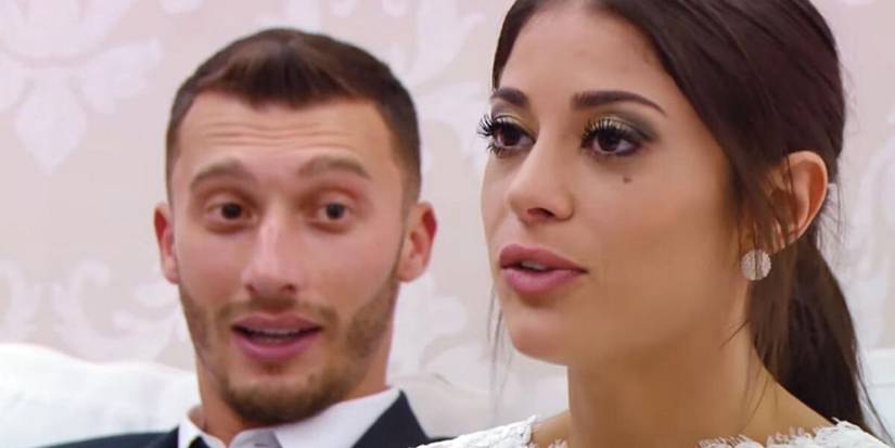 90 Day Fiance's Alexei Brovarnik looking at Loren Brovarnik dressed up in wedding attires