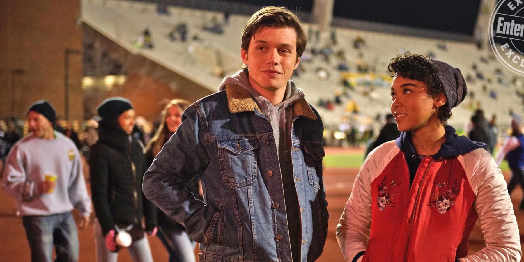 Abby looks lovingly at Simon during a football game in Love, Simon.