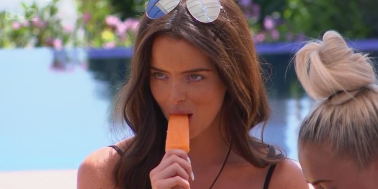 Maura eating an orange popsicle in Love Island UK's fifth season. 