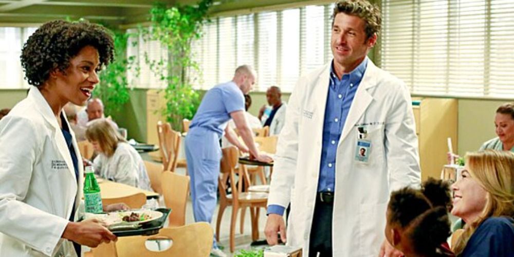 Maggie talks to Zola and Meredith as Derek smiles at hospital cafe Grey's Anatomy