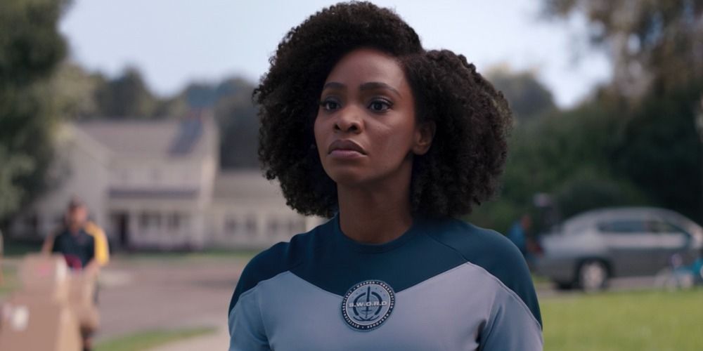 Monica Rambeau from Wandavision in her uniform standing confidently in a field