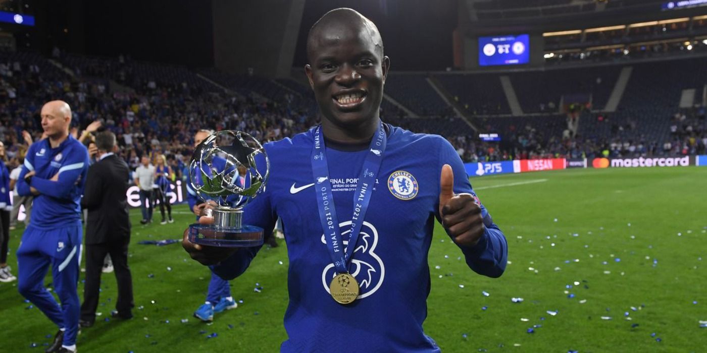 N'Golo Kanté posing with his Champions League Winners Medal and Man Of The Match Trophy 