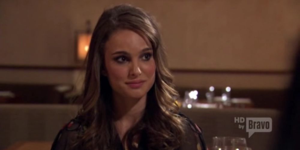 Natalie Portman on Top Chef smiling slightly and looking to the side