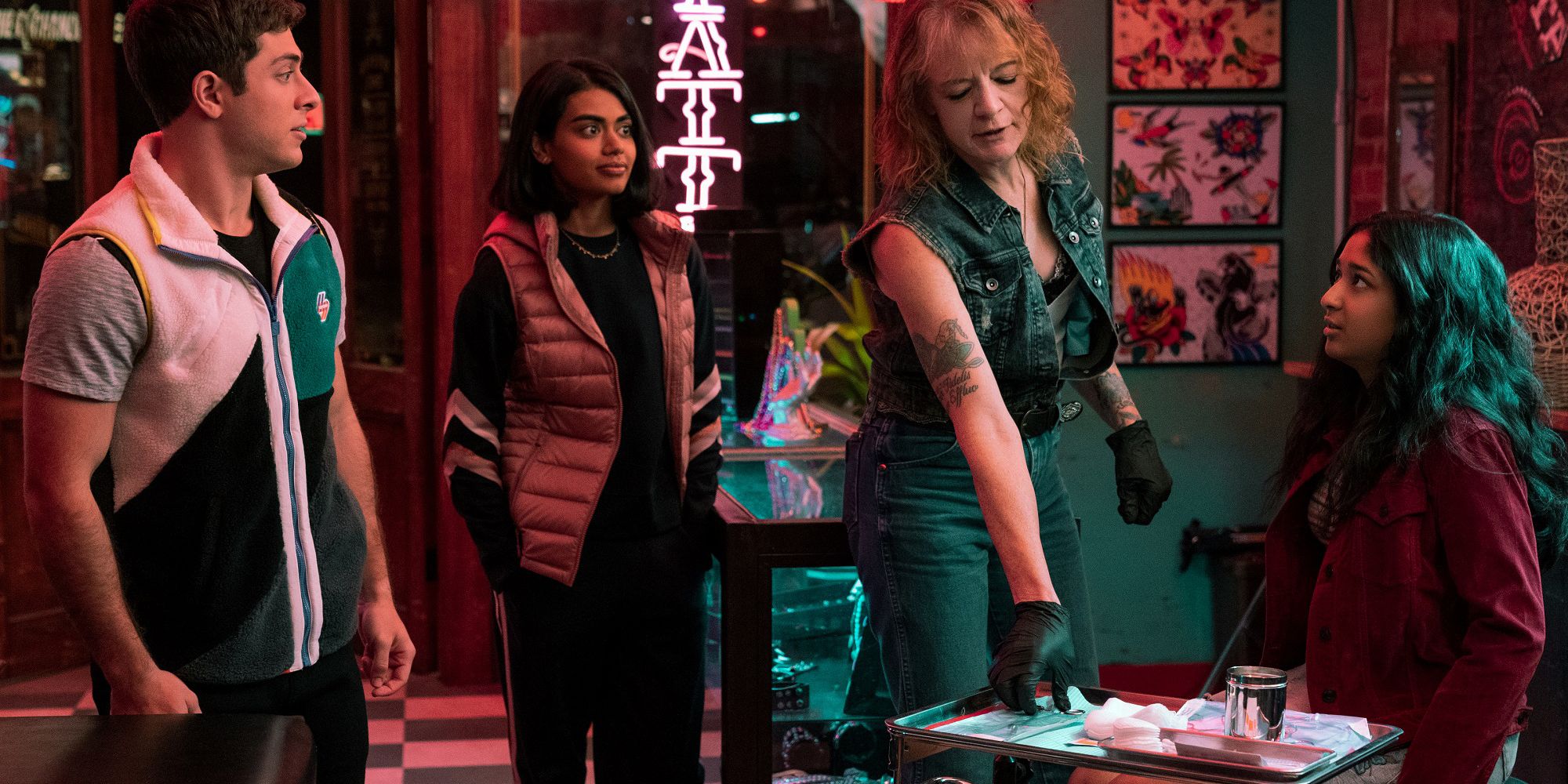 Ben, Aneesa, and Devi in a tattoo parlor in Never Have I Ever.