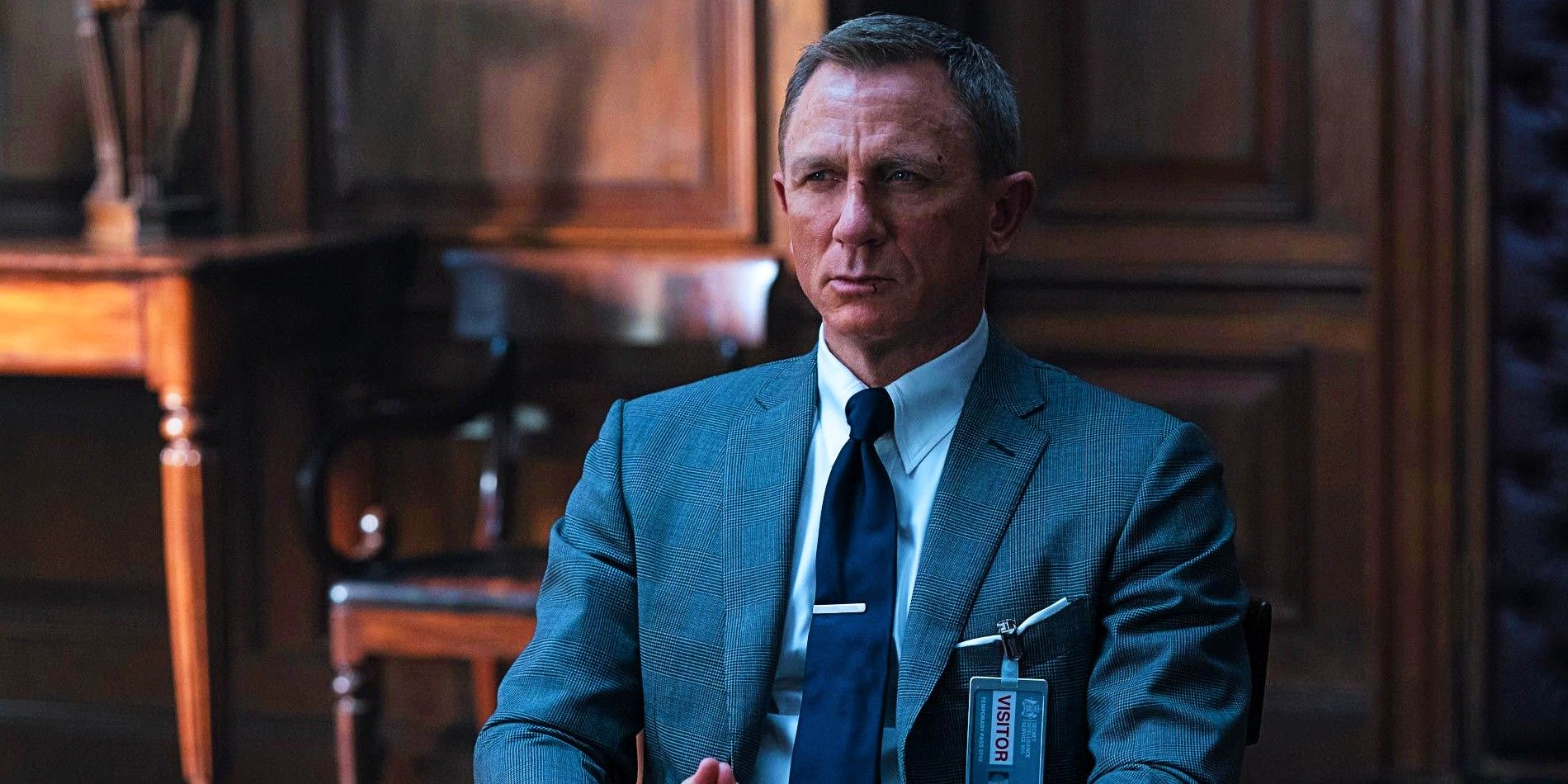 James Bond sits in M's office in No Time to Die