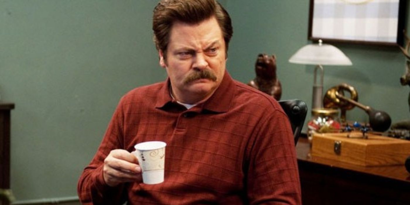 Ron Swanson holding a cup of coffee and doing a disgusted expression in Parks and Recreation