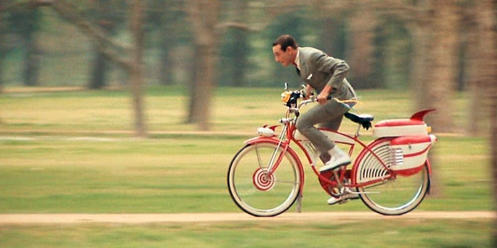 Pee Wee zipping through a park on his bike in Pee Wee's Big Adventure