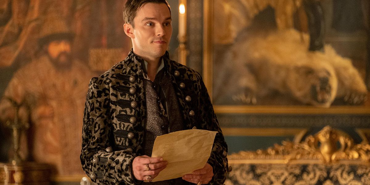 Peter (Nicholas Hoult) wearing a dark leopard coat on Catherine's 21st birthday in The Great