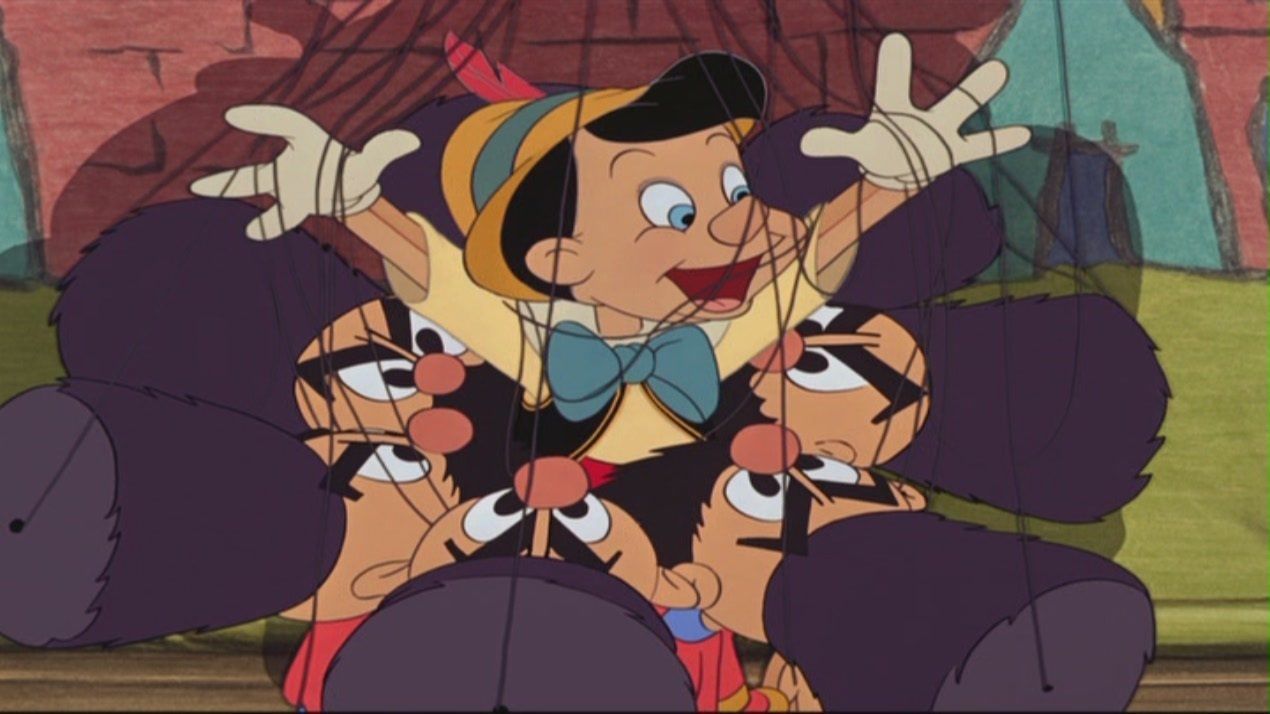 Pinocchio gets tangled in the strings of his fellow puppets