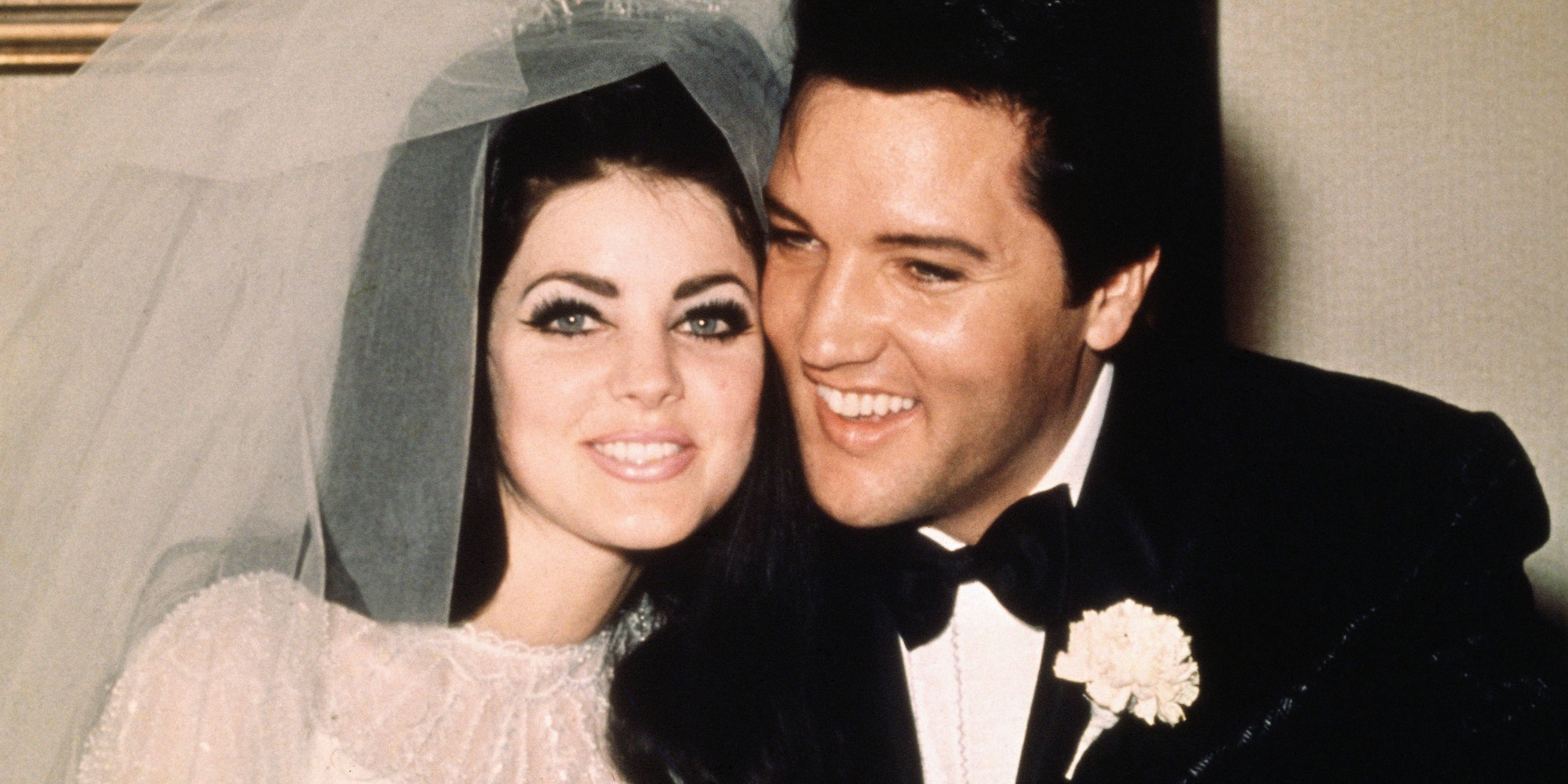 Priscilla Presley and Elvis Presley sitting next to each other in a wedding photograph 