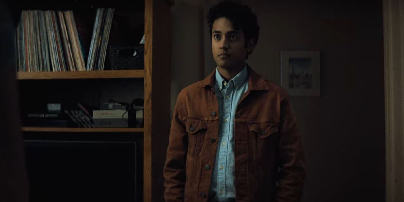 Ali Hassan standing in a living room in Netflix's Midnight Mass.