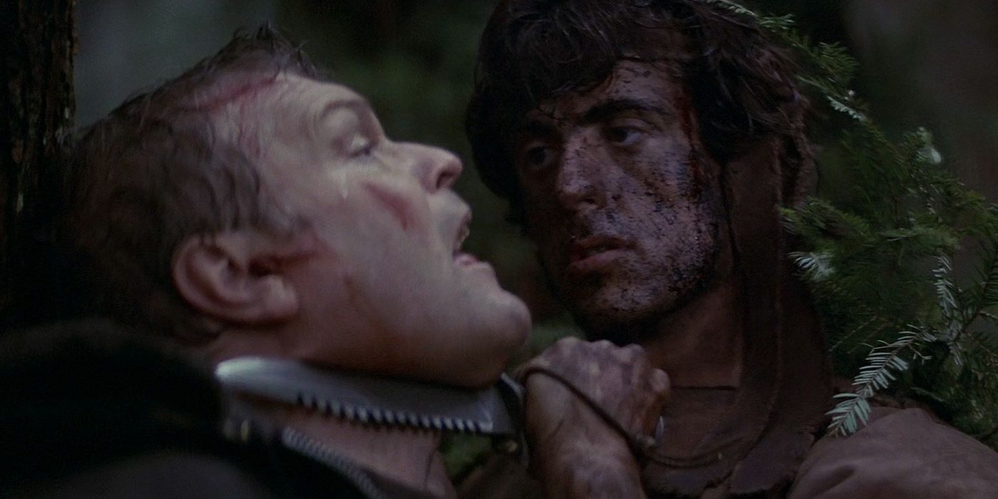 Rambo holds a knife to Sheriff Teasle's throat in First Blood
