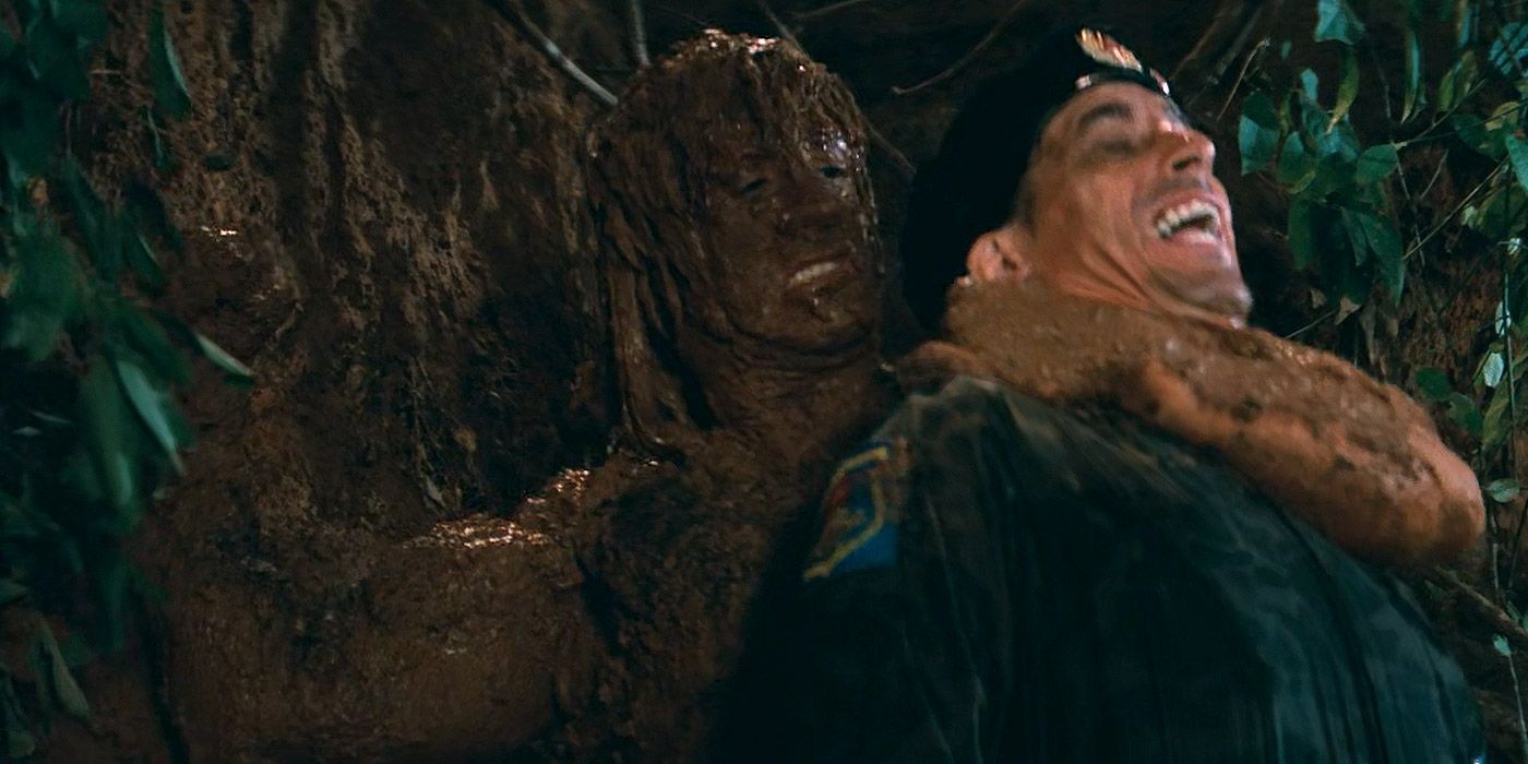 Rambo camouflaged in mud, and killing a Soviet soldier in Rambo: First Blood, Part II