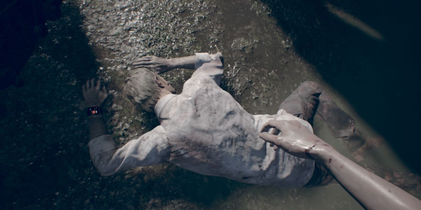 Ethan trapped in the mud in Resident Evil VII.