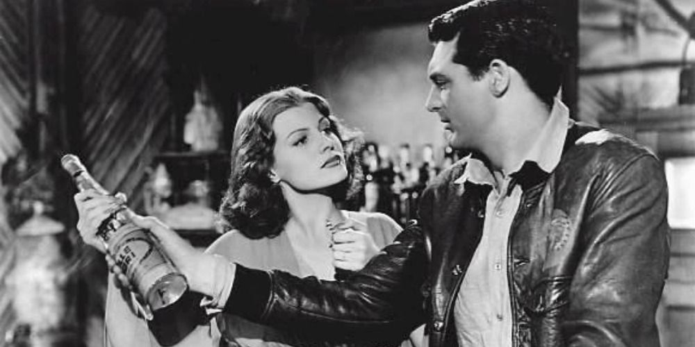 Rita Hayworth and Cary Grant fight over a bottle in Only Angels Have Wings