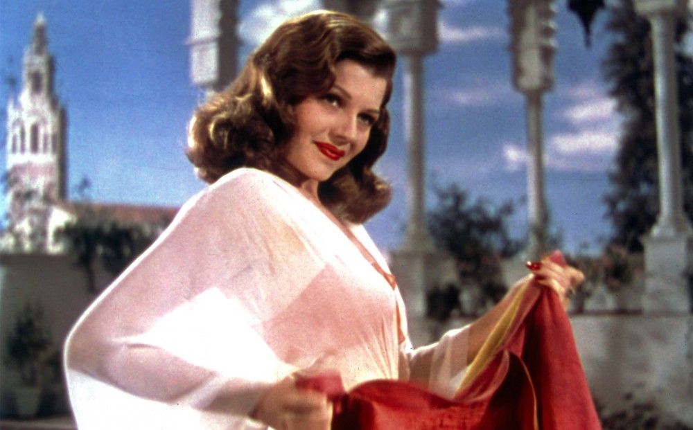 Rita Hayworth in red and white in Blood and Sand
