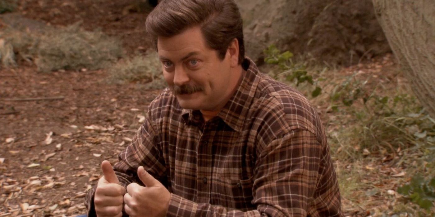 Ron sat in the woods giving a double thumbs up in Parks and Rec