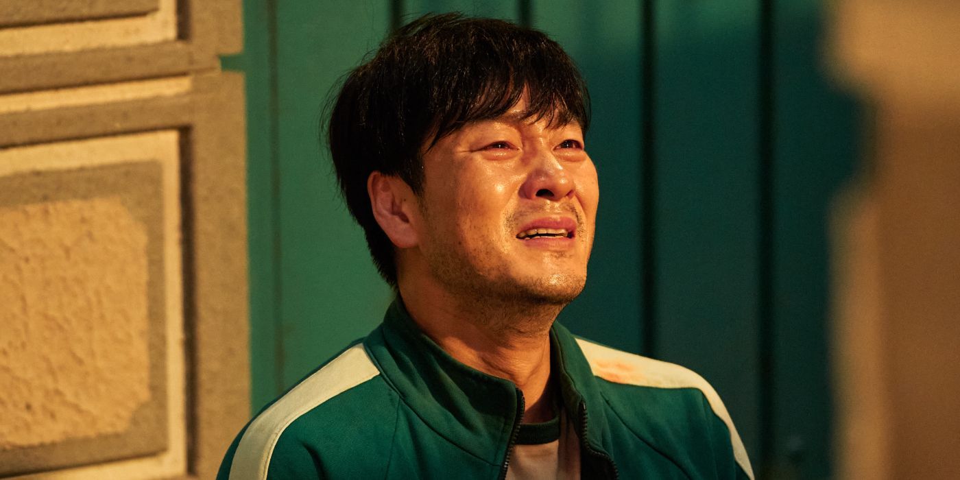 Sang-woo crying in his green track suit in the Netflix show Squid Game.