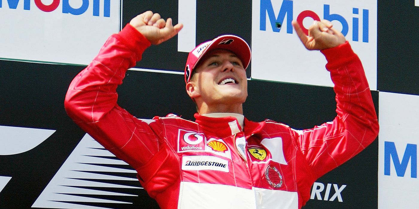A car racer lifts his arms in celebration in Schumacher 