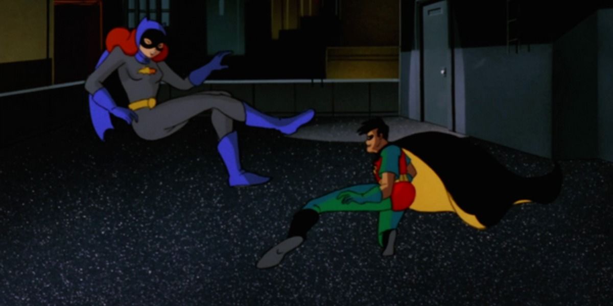 Robin literally sweeps Batgirl off her feet.