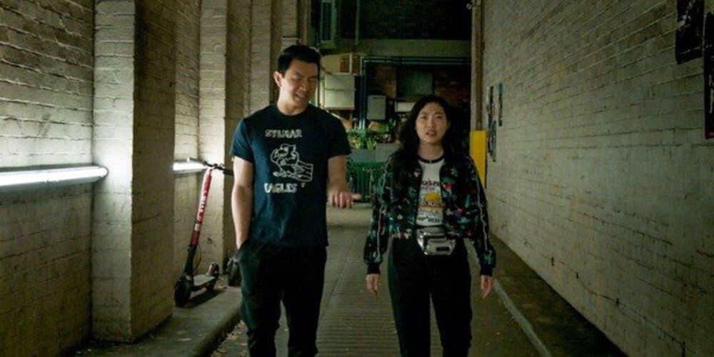 Shang-Chi and Katy walk in an alley
