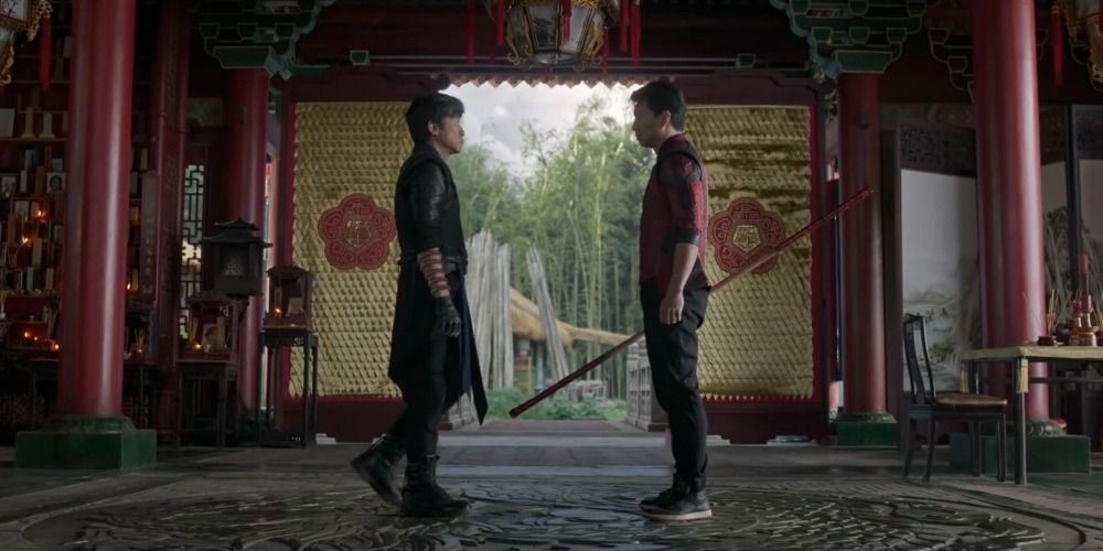 Shang Chi and Wenwu facing each other down in a shrine, in Shang Chi and the Ten Rings