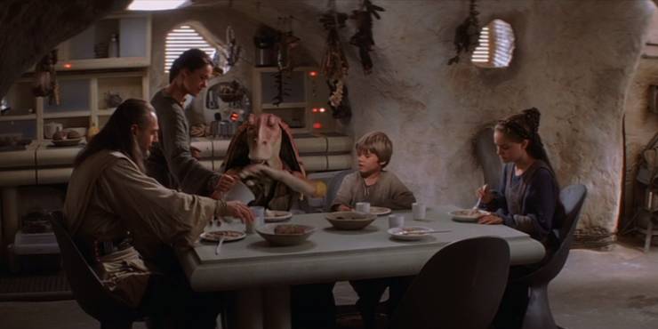 Shmi Skywalker feeds dinner to Qui Gon Jar Jar Anakin and Padm in their home in The Phantom Menace.jpg?q=50&fit=crop&w=740&h=370&dpr=1
