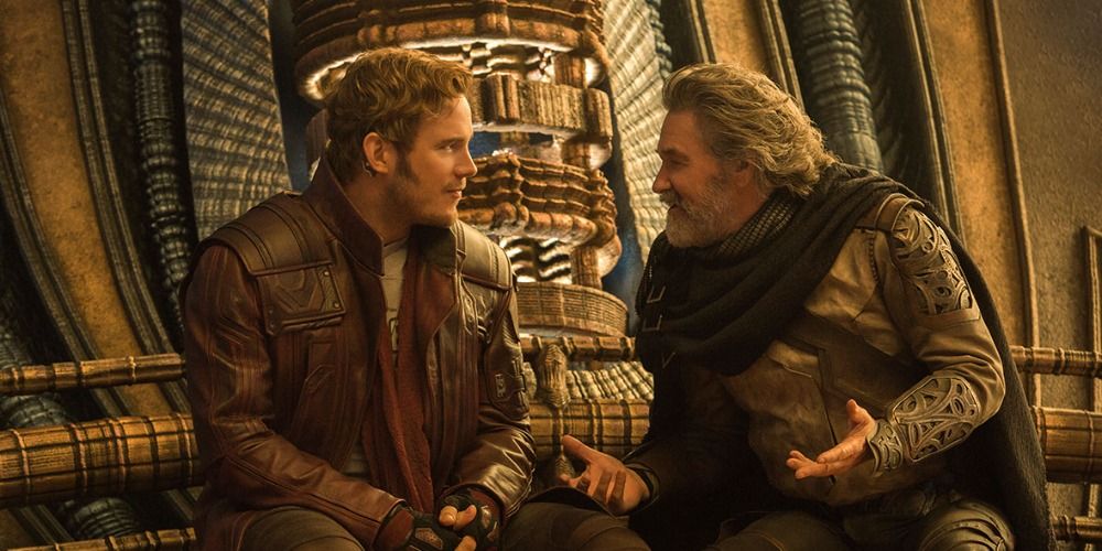 Starlord and Ego sittinh down and talking in Guardians of the Galaxy 2
