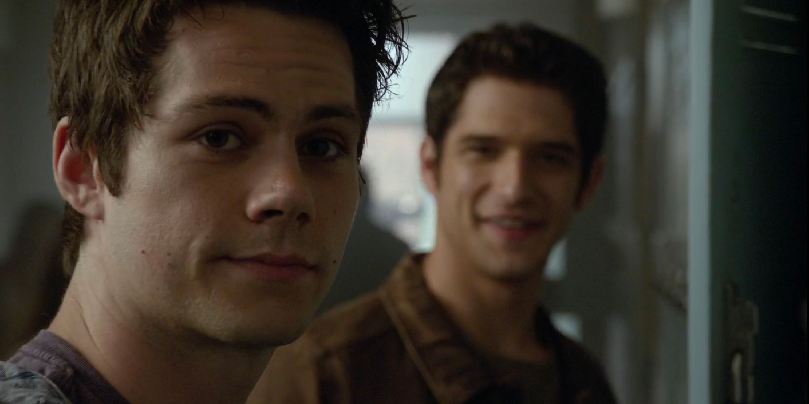 Stiles and Scott smiling at Lydia in Teen Wolf.