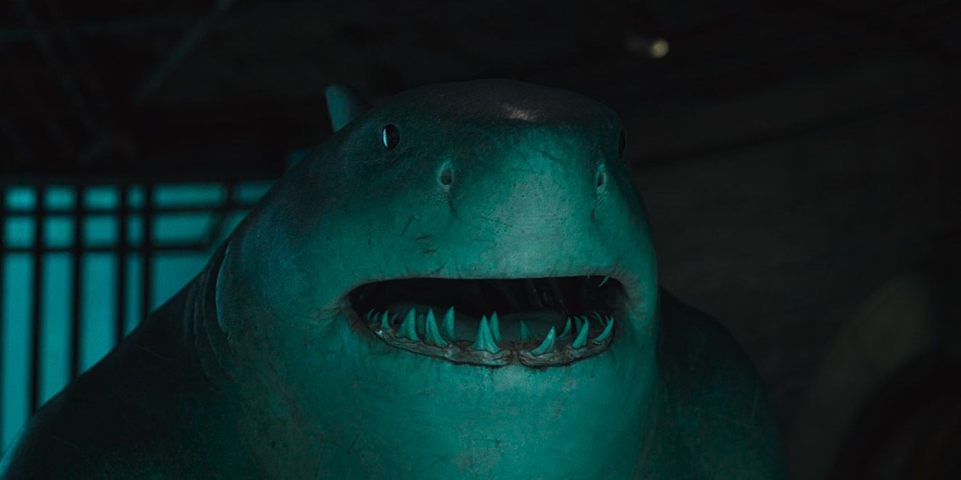 King Shark stares at an aquarium of alien creatures in The Suicide Squad