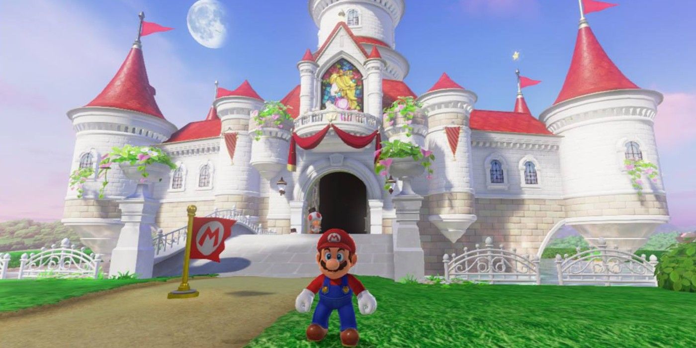 Mario standing in front of Peach's castle in Super Mario Odyssey