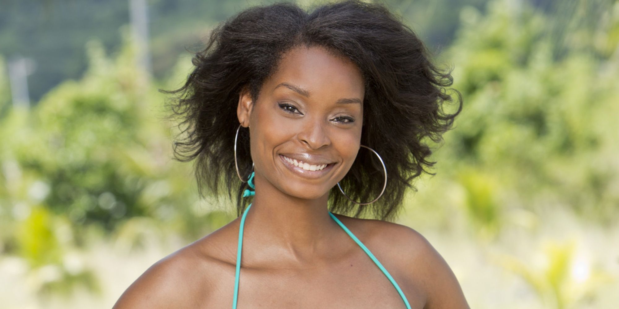 J'Tia Taylor from Survivor smiling at the camera